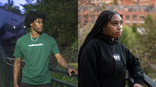 Two models wearing the UNLONELY Signature Tee in the Forest colorway and the UNLONELY Box Logo Hoodie in the Black colorway.